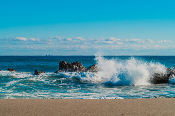 Violent waves crashing against rocks