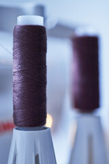 Close-up of a thread coil on a sewing machine