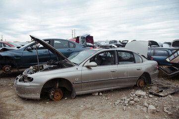 Obraz na płótnie Canvas Melbourne, Victoria / Australia - July 18 2020: Old wrecked cars in junkyard. Car recycling.