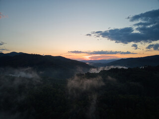 Fototapeta na wymiar Foggy Sunset in the Mountains
