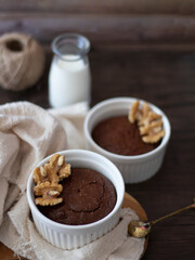Homemade Brownies in Ramekins. Round Brownies and Milk with Wooden Background. Side View of Brownies with Copy Space.