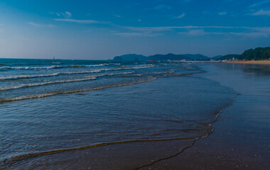 Waves rolling onto beach