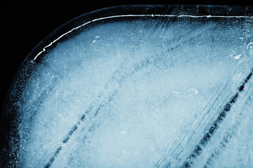 Obraz na płótnie Canvas Closeup of a cracked ice texture. Studio macro shot.