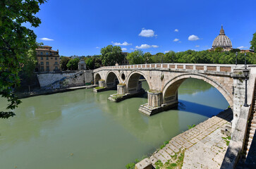 Fototapeta na wymiar Rome, Sisto bridge with St. Peter dome at background