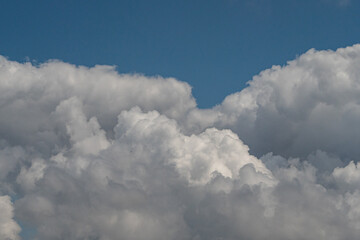 beautiful thick white cloud on deep blue sky background 