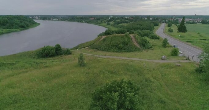 Russian landscape. Beautiful views of an ancient mound on the Bank of the Volkhov river, taken from a quadcopter on a summer day. According to legend, this hill is the grave of the "prophetic" Oleg, R