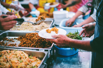 The concept of feeding : Receiving food for the poor from volunteers