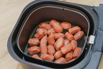Homemade mini hotdog in air fryer, Traditional Thai food.