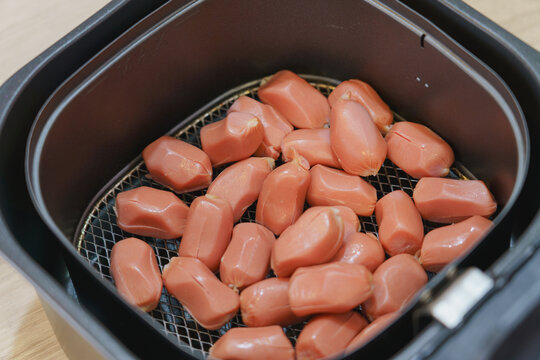 Homemade mini hotdog in air fryer, Traditional Thai food.