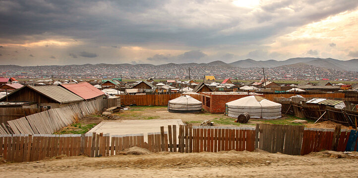 Portable yurts are set among more permanent houses in the outskirts of Ulaanbaatar, Mongolia.