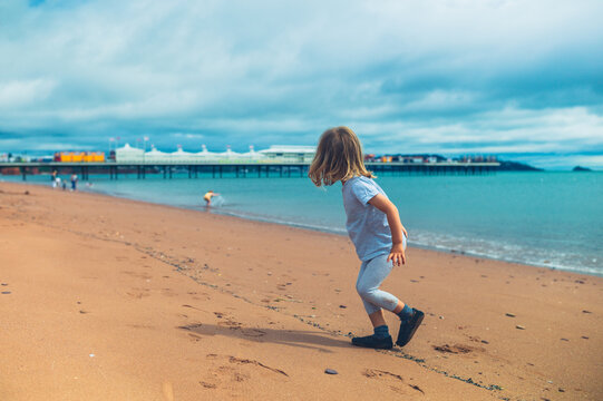 Preschooler boy playing on the beach