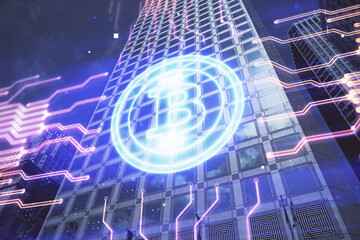 Double exposure of crypto currency theme hologram drawing and city veiw background. Concept of...