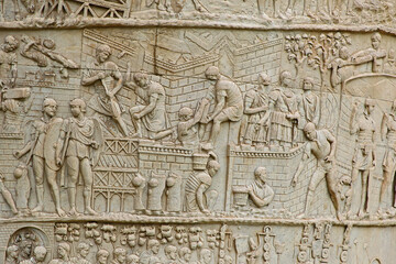 Trajan's column on the streets of Rome showing exquisite carved detail of Roman workers