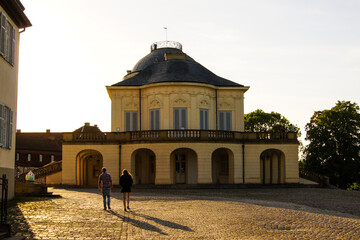 Scenic view of a couple walking in front of Solitude Palace near the city of Stuttgart in the...