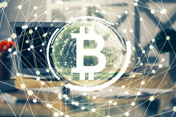 Multi exposure of blockchain theme hologram and table with computer background. Concept of bitcoin crypto currency.