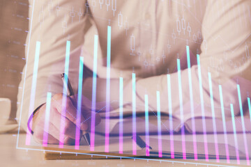 Financial trading chart multi exposure with man desktop background.