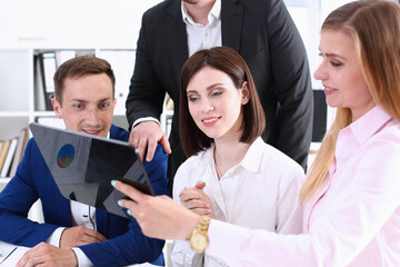 Group of people in office look at mobile tablet pc. Funny internet video, white collar colleague share job plan at workplace, busy lifestyle, corporate style, new worker interview, web search concept