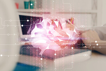 Multi exposure of writing hand on background with brain hologram. Concept of learning.