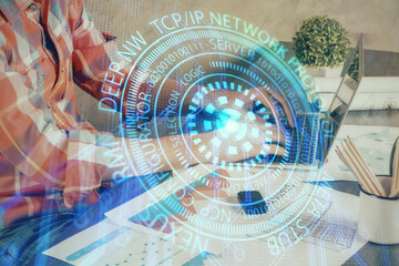 Double exposure of technology hologram with man working on computer background. Concept of big data.