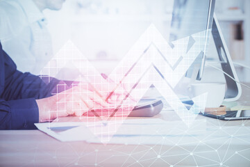 Growing arrows with businessman working on computer on background. Success concept. Double exposure.