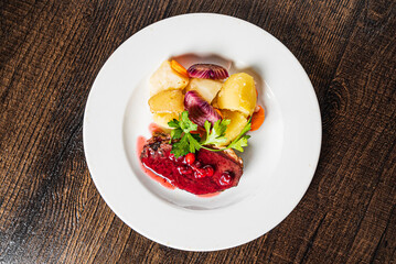 steak with cherry sauce and roasted vegetables
