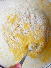 woman mixing dough for baking muffins
