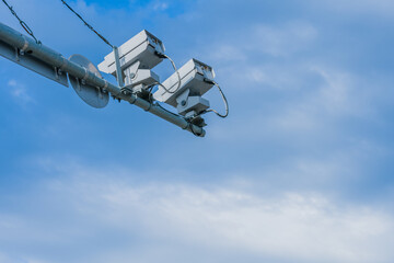 Speed radar cameras against blue sky