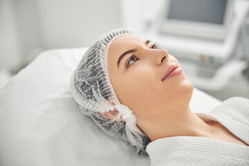 Attractive lady feeling calm in hospital chamber