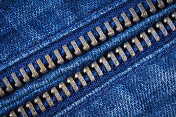Blue denim jeans with zipper texture background.
