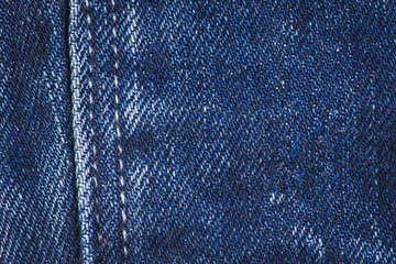 Blue denim jeans with stitches texture background.