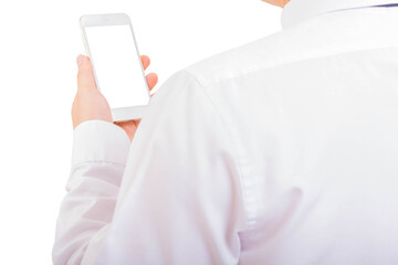 Man in white suit use smart phone with hand holding new smartphone and looking it with over white background, rear view. Business concept.