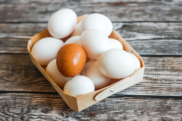 Eggs in a box. Eggs on a wooden table. Organic products