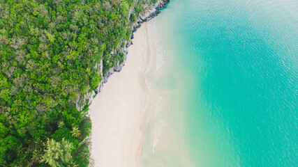 Sea of Thailand Top View, Wave of Turquoise ocean water on sandy beach, High angle view sea and sand background, Aerial top view of Khanom beach, Khanom, Nakhon Si Thammarat Thailand