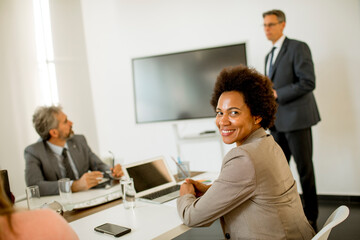 African American business woman  sitting by the table while working on new project