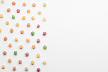 Close up of colorful fruit caramel, hard sugar candies or boiled sweets isolated on white background