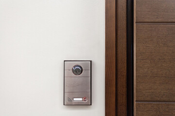 Modern house with contemporary doorbell near door