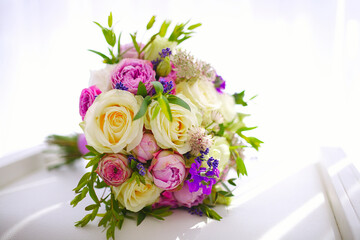 Wedding bouquet of flowers from freshly cut roses and other beautiful flowers in the composition