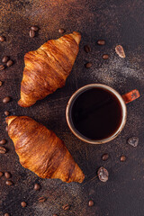 Obraz na płótnie Canvas Coffee and croissant on stone background.