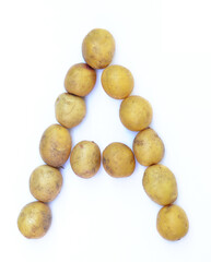 Letter A of the English alphabet from potatoes. A letter made of fruit on a white background.