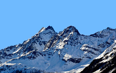 Fototapeta na wymiar Dolomites mountains in Bormio region on sunny winter day in Bormio, Italy.