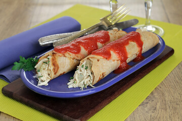 Chicken pancake with herbs and tomato sauce