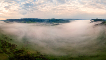 beautiful landscape with valleys, lakes and rivers in fog