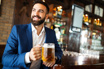 Young business man having a break in a restaurant. Work occupation business lifestyle concept