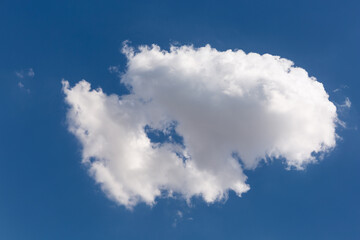 Naklejka na ściany i meble big white cloud of interesting shape, heart-shaped hole in the middle of the cloud, concept