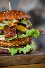 Cheeseburger on a wooden cut board