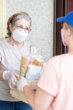 Delivering Food To Senior Woman During Quarantine Coronavirus (Covid-19) Epidemic