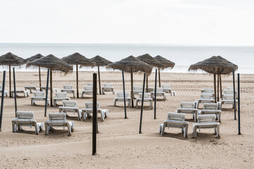 Empty deck chairs at beach on quarantine times