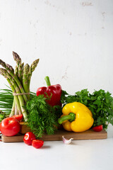 Red and yellow bell pepper on white table, cooking concept