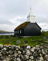 Sandoy, Faroe Islands: Black wooden church of Sandur with grass roof, that was renovated after an...