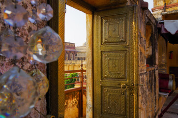 Beautiful brass covered door inside Amber Fort and Palace near Jaipur in Rajasthan in India during...
